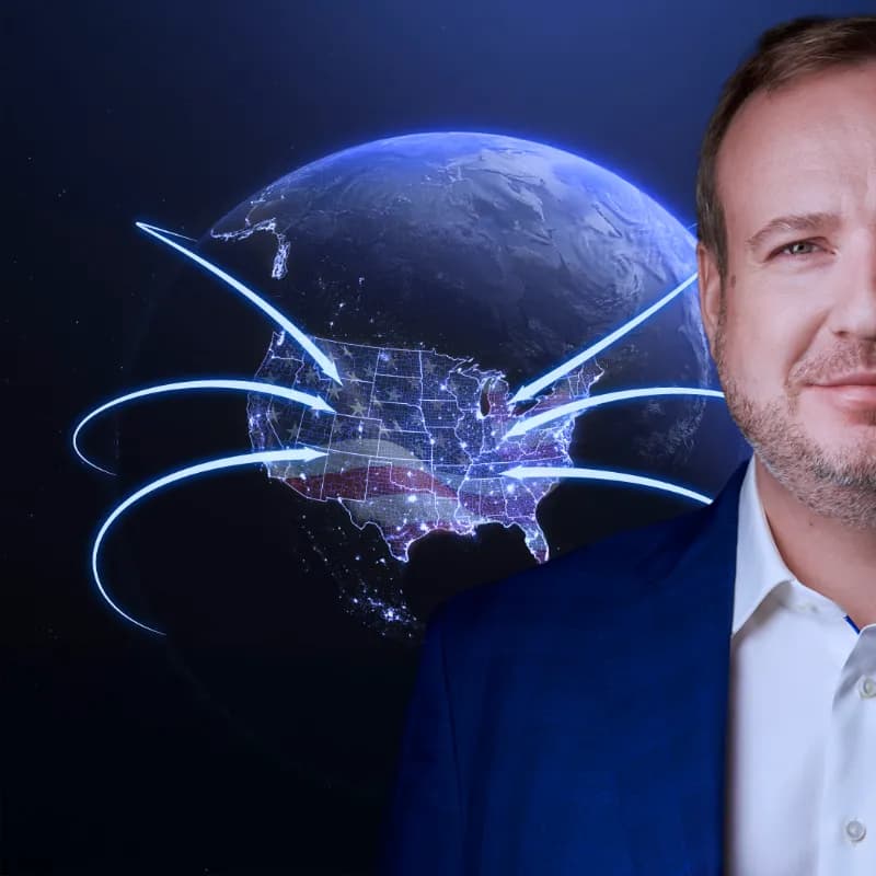 Dr Rafael H. Kartaszynski beside an illustration of routes converging on the United States